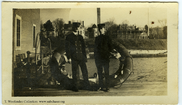 life raft with officers standing next to it