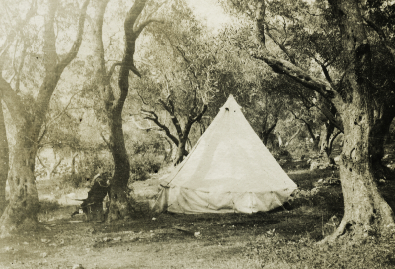 Sailor by a tent at Base 25, Corfu, Greece.